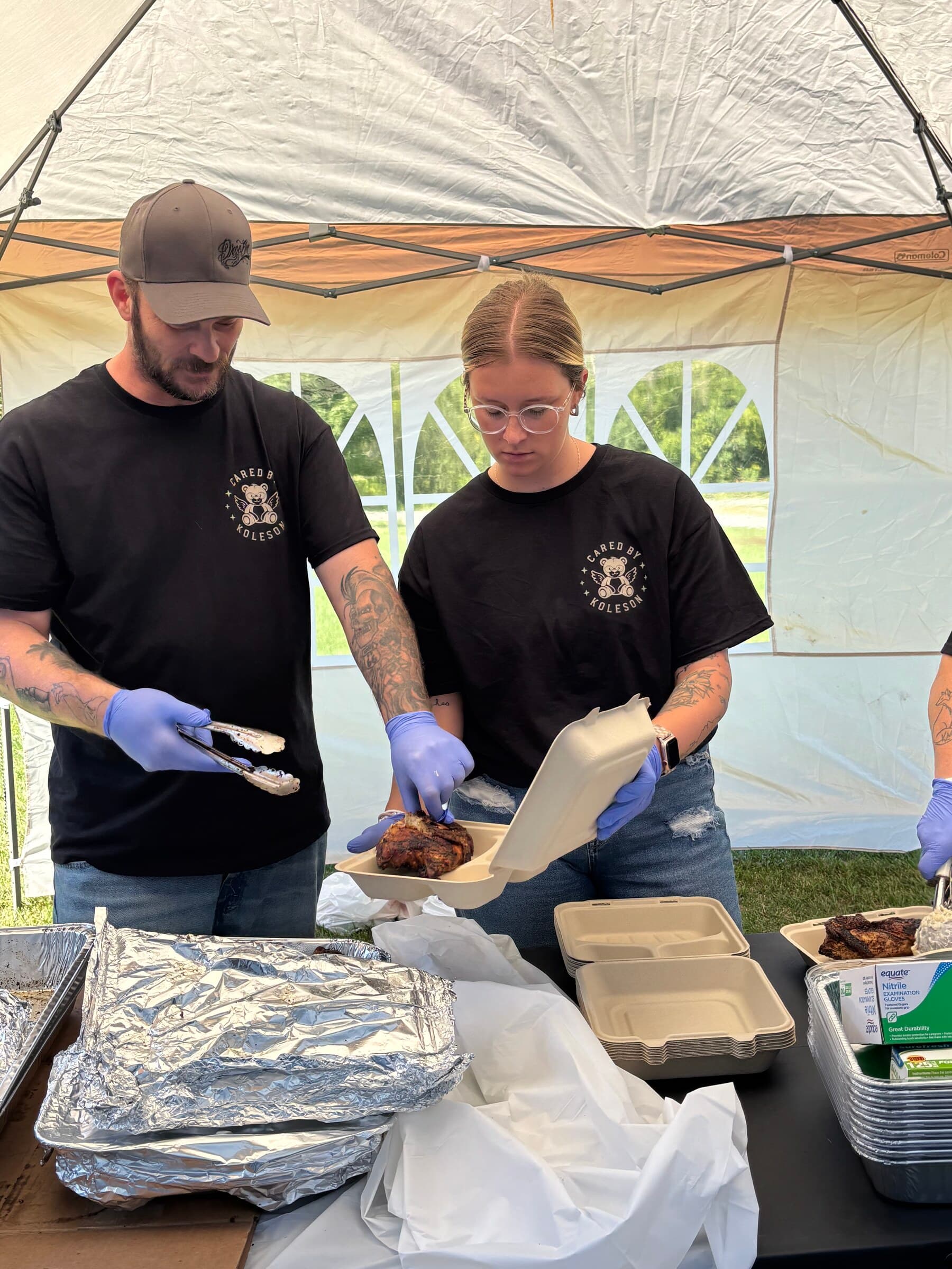Volunteers plating Chiavetta's chicken under the tent