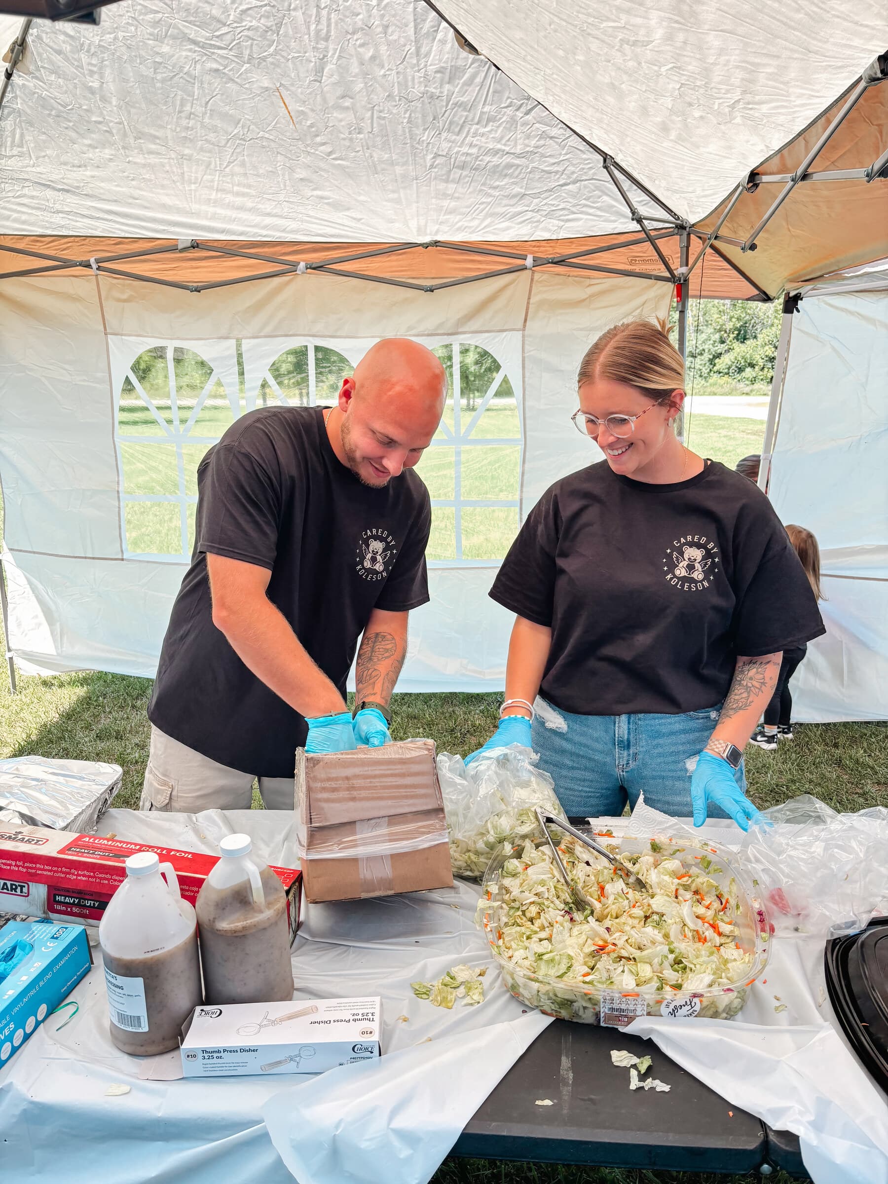 Volunteers prepping coleslaw and sides before service